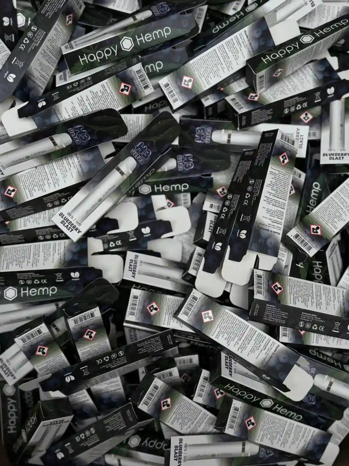 Viele H3 Ultra Vape Pen Verpackungen der Sorte Blueberry liegen übereinander